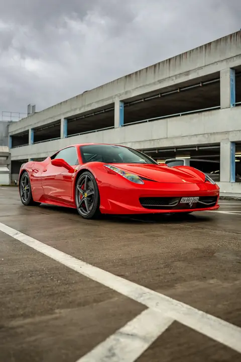 Red Ferrari 458 Italia for luxury sports car rental in Zurich, Switzerland