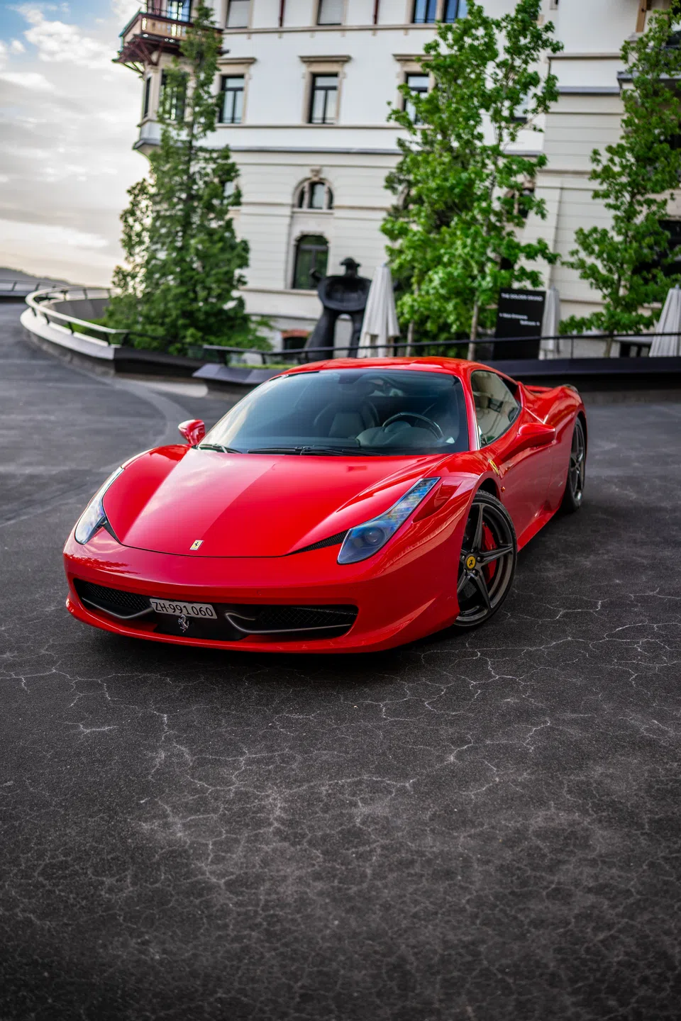 Ferrari 458 Italia positioned at the hotel entrance