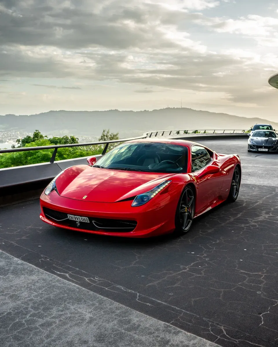 Ferrari 458 Italia with a panoramic sunset view over Zurich
