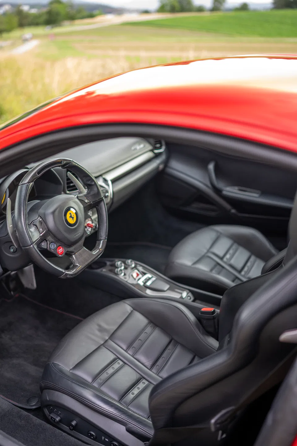 Black leather seats and cockpit of the Ferrari 458 Italia