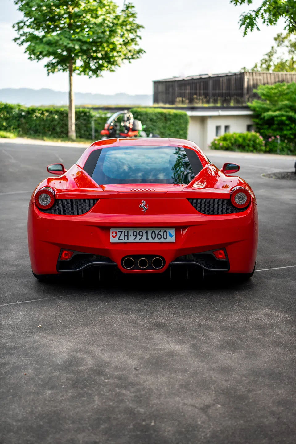 Rear view of the Ferrari 458 Italia outside the office