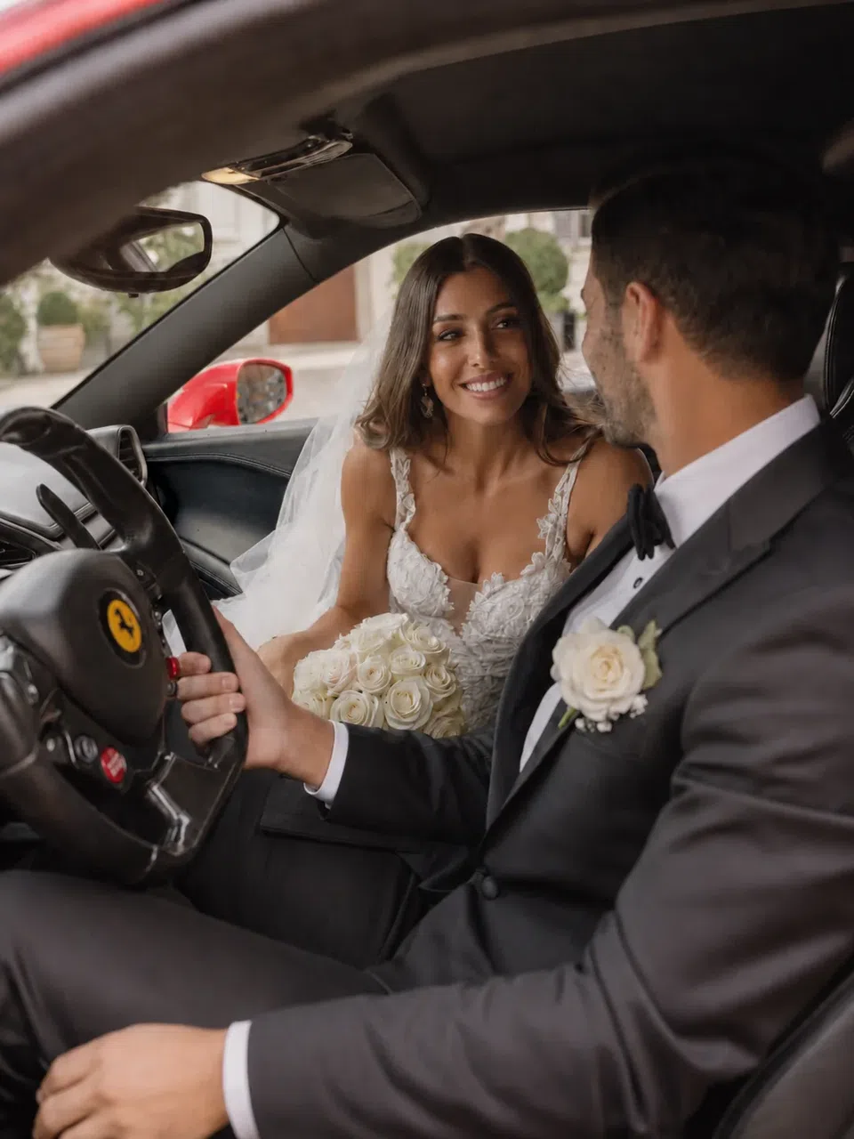Wedding couple inside the Ferrari 458 Italia